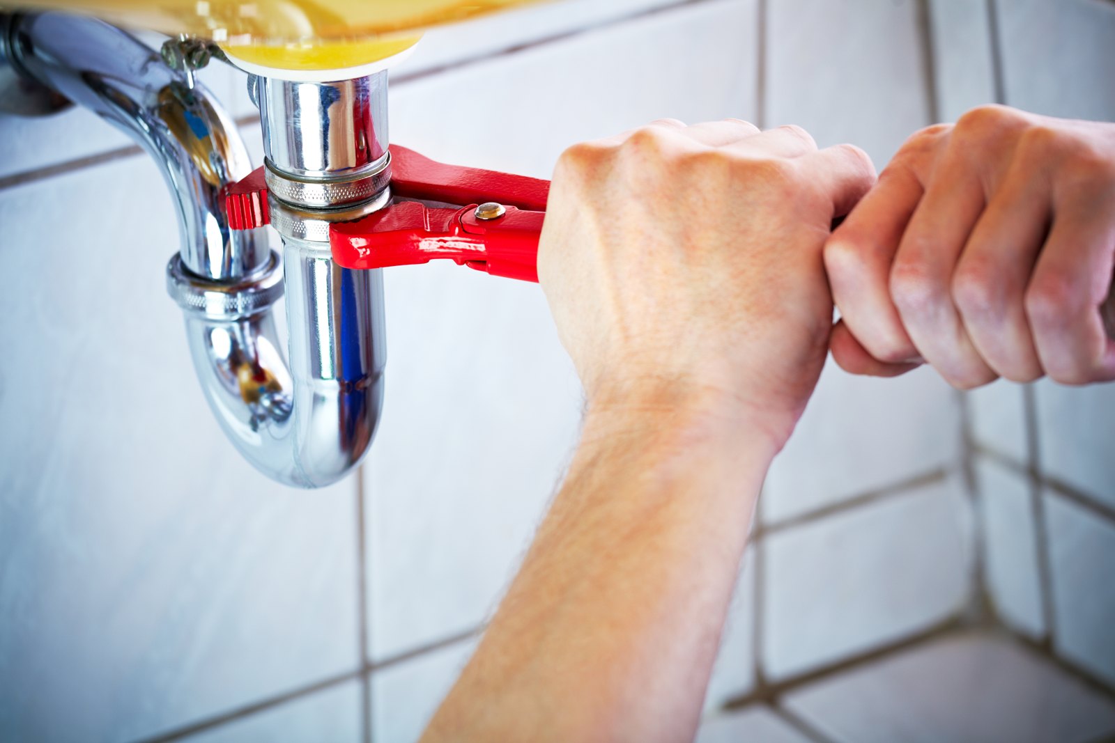 Work on accessible plumbing beneath a sink